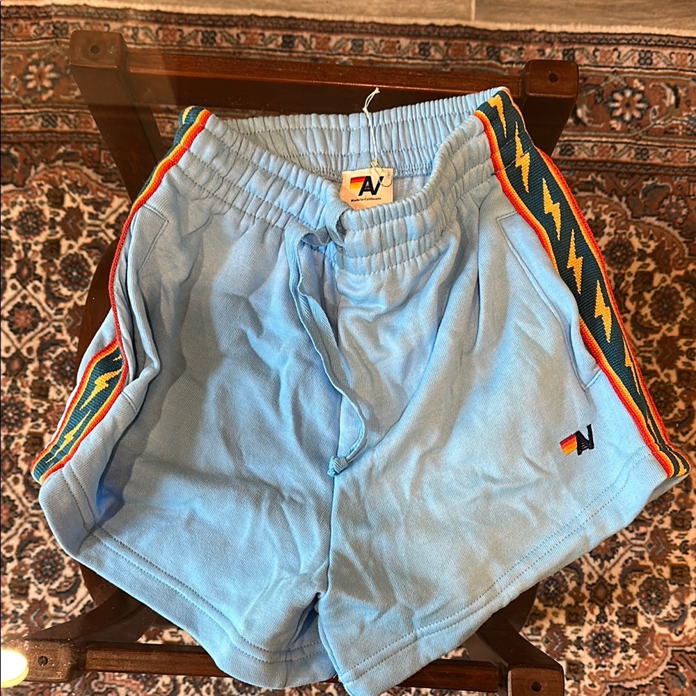 Aviator Nation Blue Athletic Shorts with Vintage Rainbow Stripes